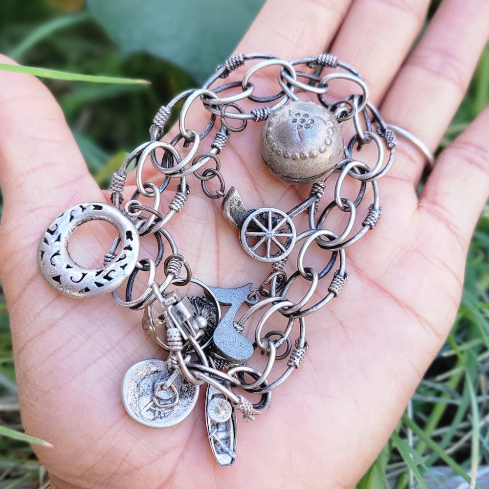 Amazing vintage 1950s LOADED sterling silver ornate charm bracelet